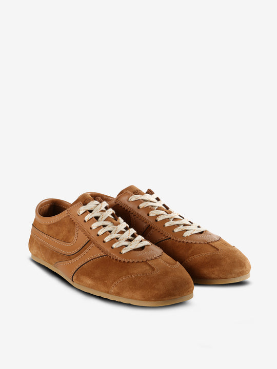 Tan sneakers, side view