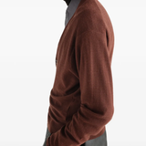 Brown knitwear worn by a person, showing the knitwear fit
