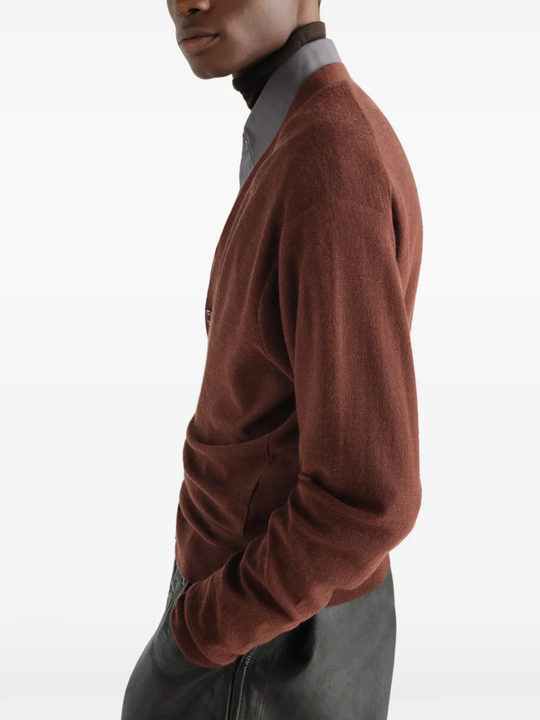 Brown knitwear worn by a person, showing the knitwear fit