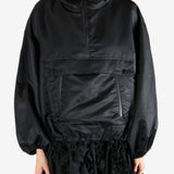 Black jacket worn by a person, showing the jacket's fit