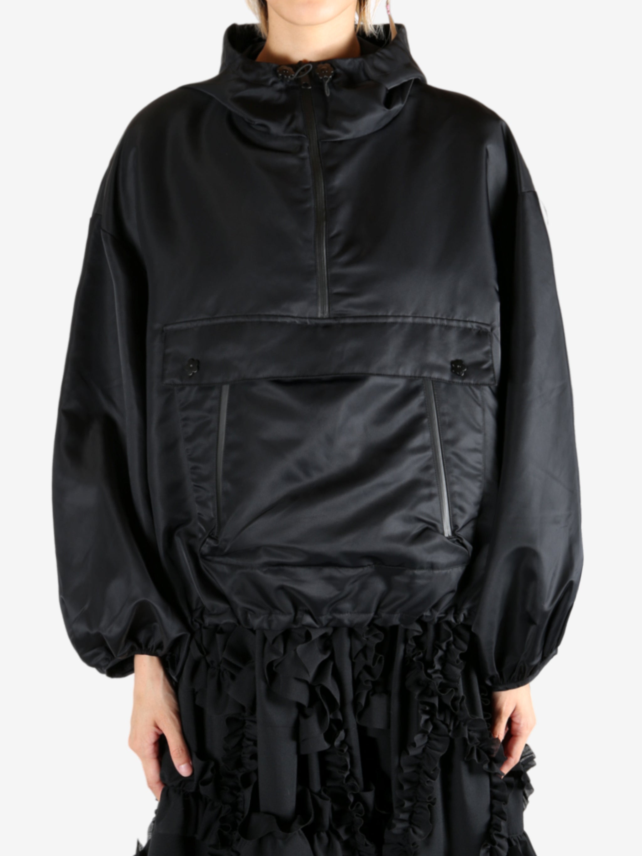 Black jacket worn by a person, showing the jacket's fit