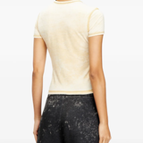 yellow top worn by a person, showing the top fit