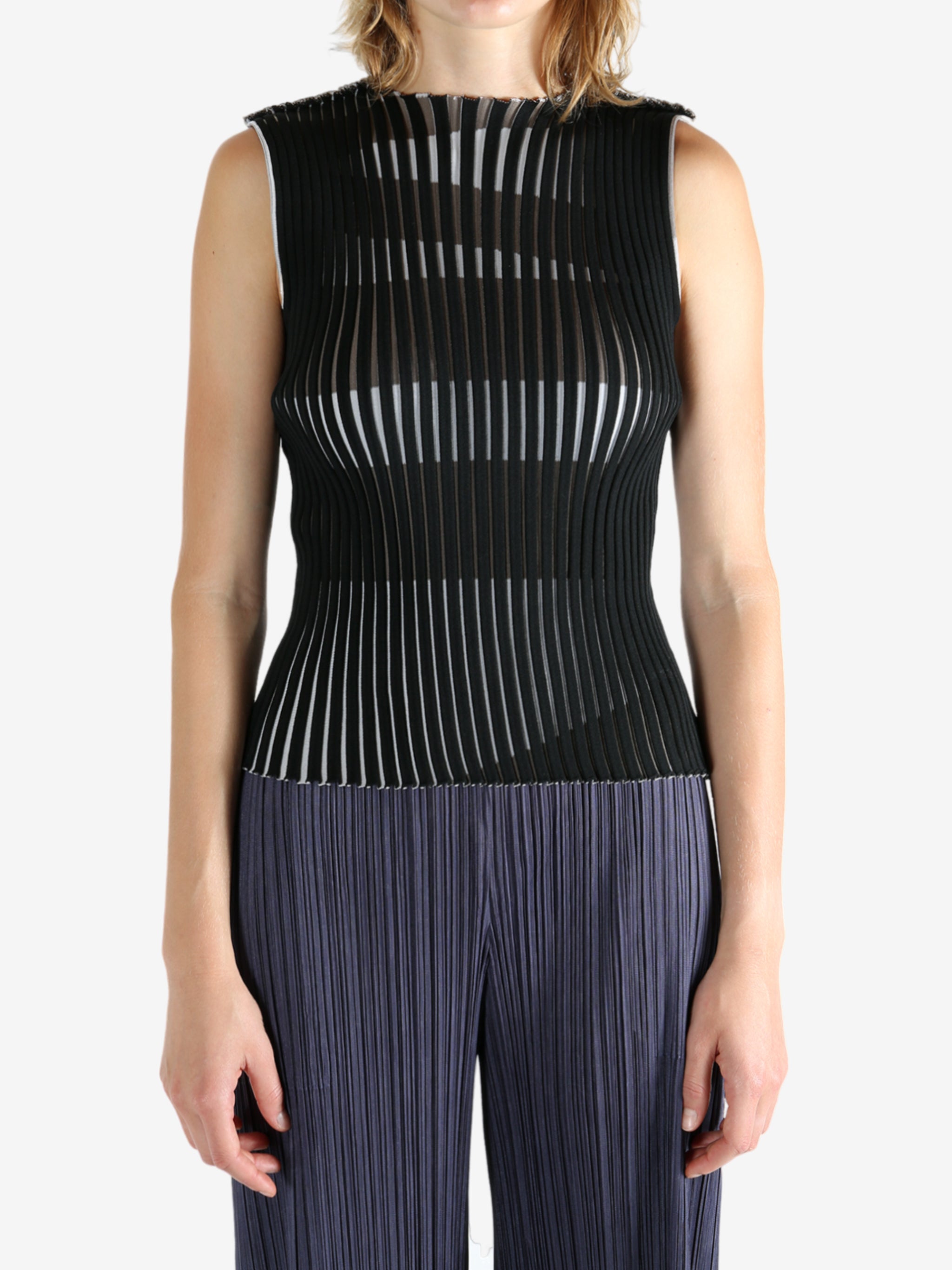 Black shirt worn by a person, showing the shirt's fit