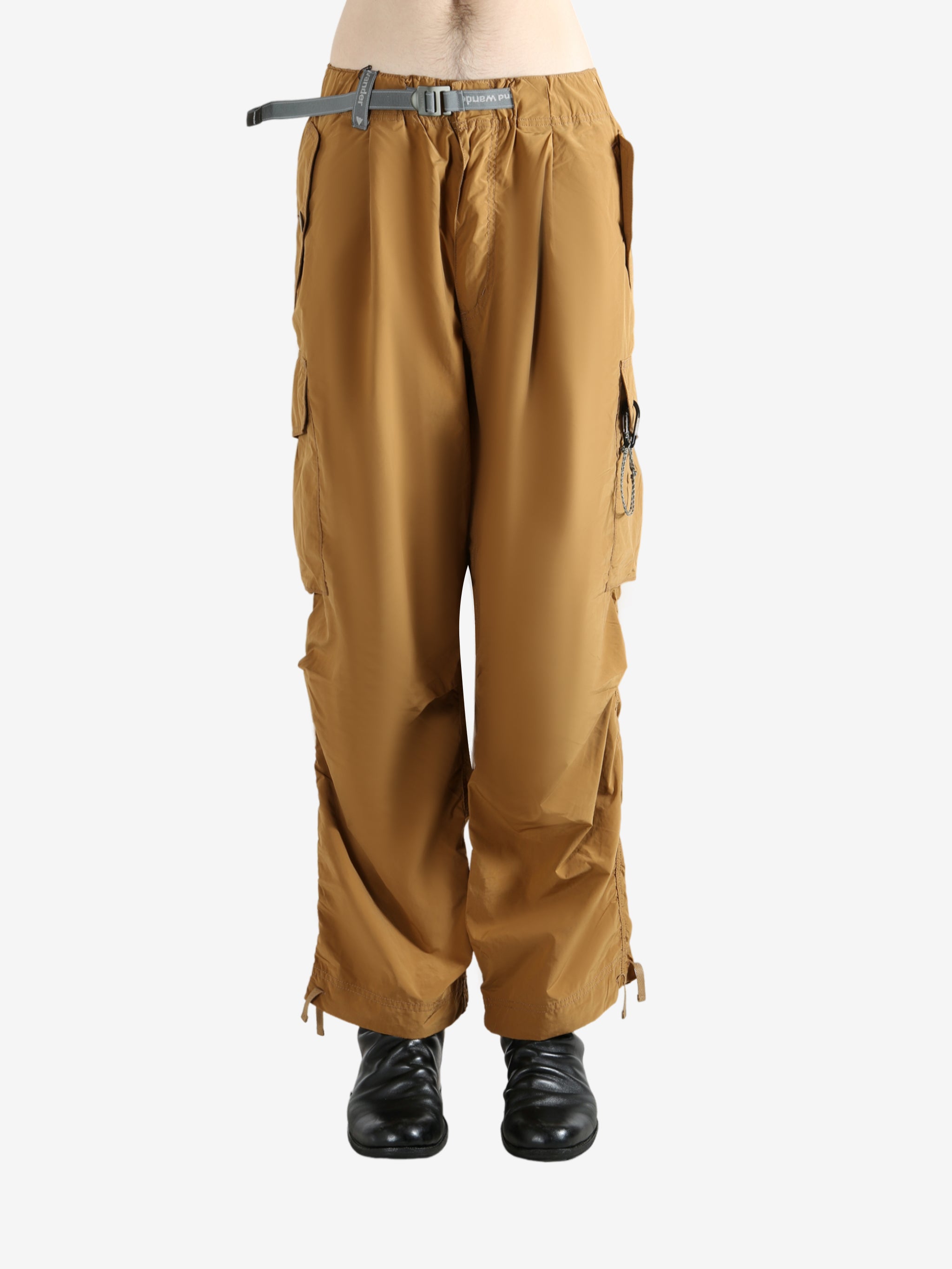 Brown pants worn by a person, showing the pants's fit