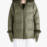 Green jacket worn by a person, showing the jacket fit