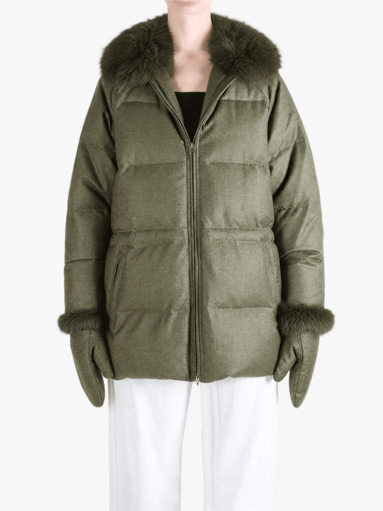Green jacket worn by a person, showing the jacket fit