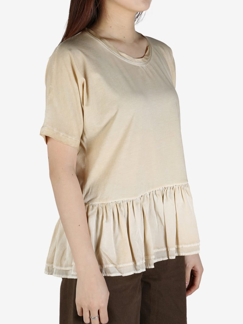 Tan top worn by a person, showing the top's fit