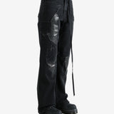 Black pants worn by a person, showing the pants' fit