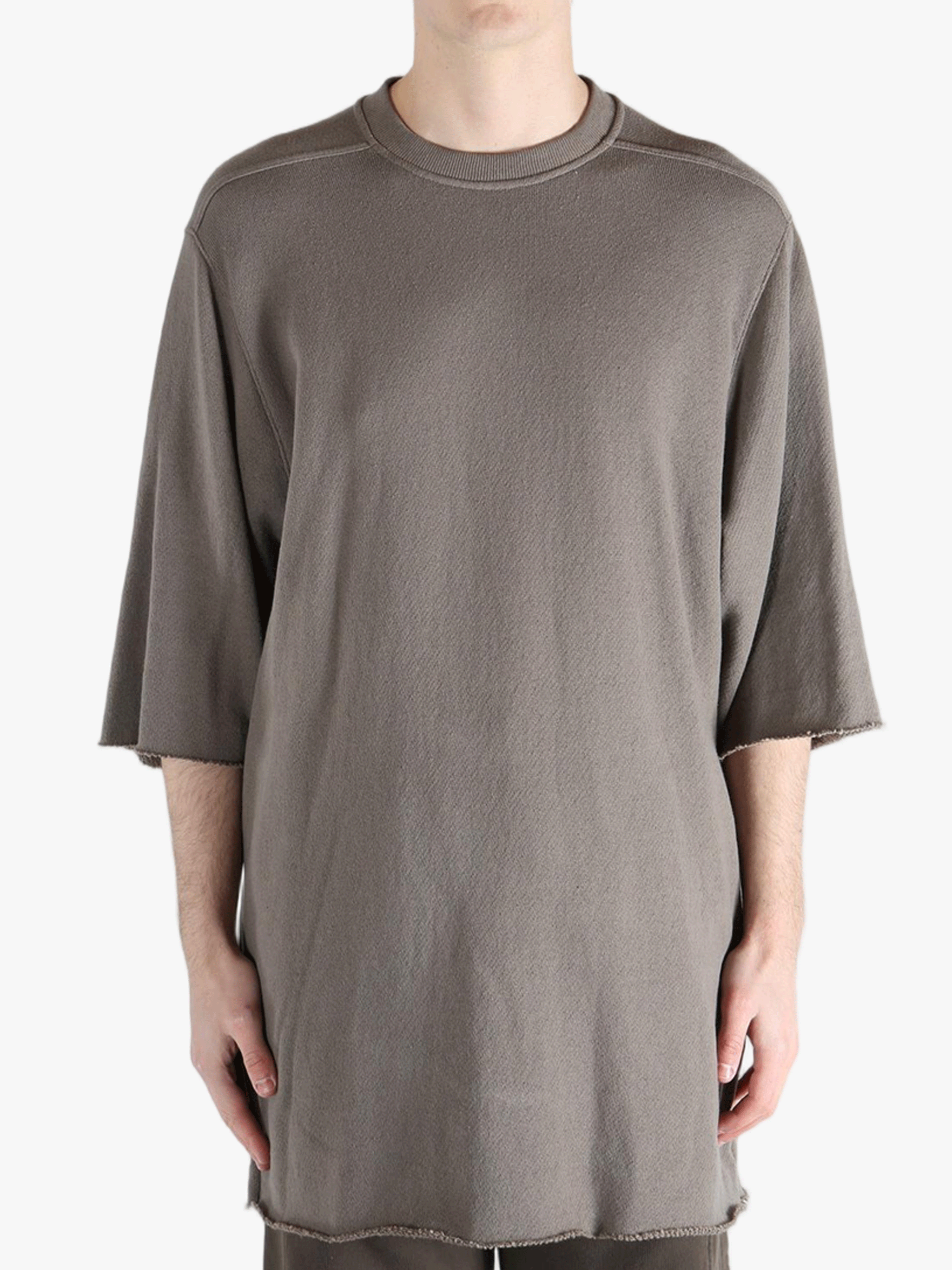 Tan t-shirts worn by a person, showing the t-shirts fit