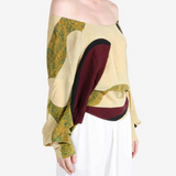 Yellow top worn by a person, showing the top fit