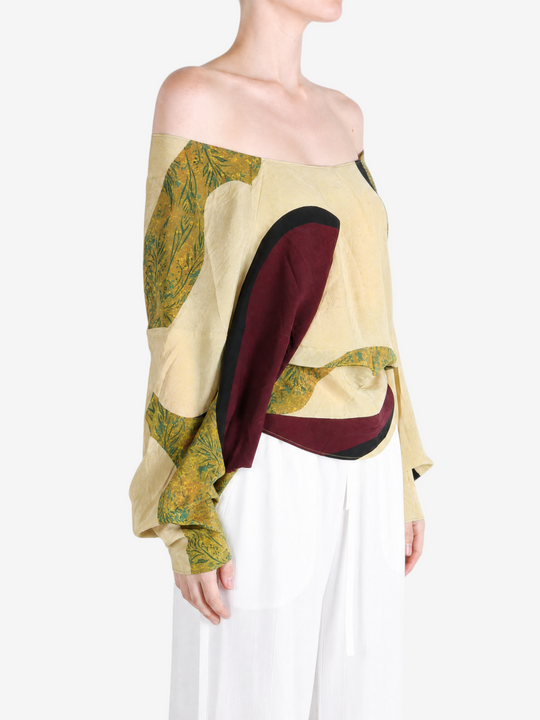 Yellow top worn by a person, showing the top fit