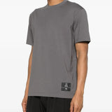 Grey t-shirt worn by a person, showing the shirt's fit