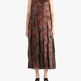 Red dress worn by a person, showing the loose fit.