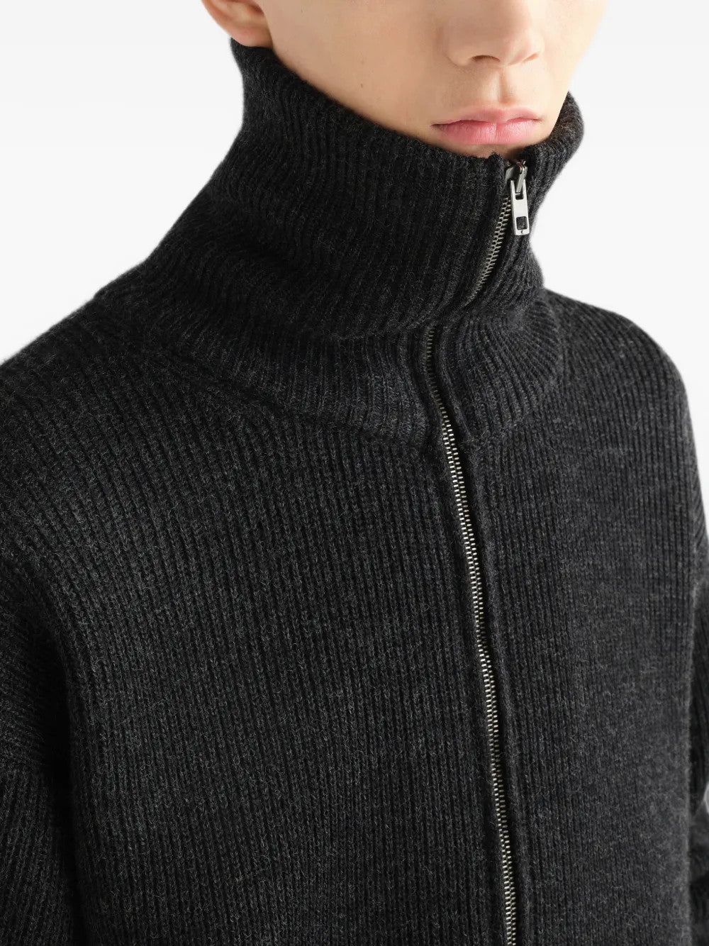 Black knitwear worn by a person, showing the knitwear fit