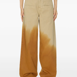 Brown pants worn by a person, showing the pants fit