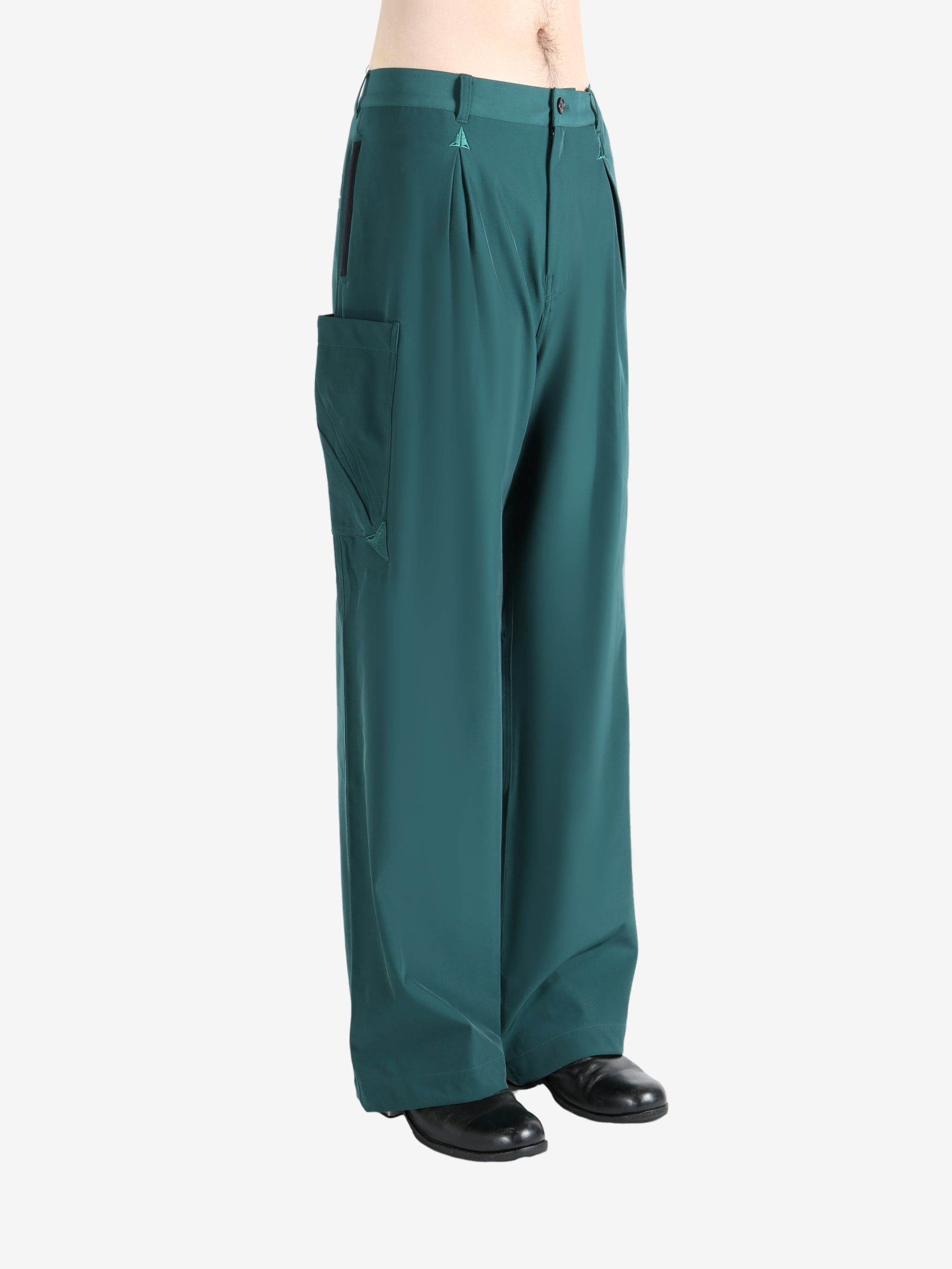 Blue pants worn by a person, showing the pants' fit