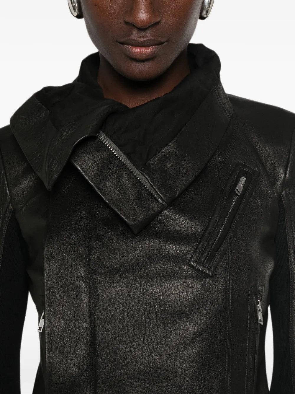 Black jacket worn by a person, showing the jacket fit
