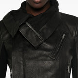 Black jacket worn by a person, showing the jacket fit