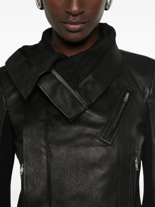 Black jacket worn by a person, showing the jacket fit