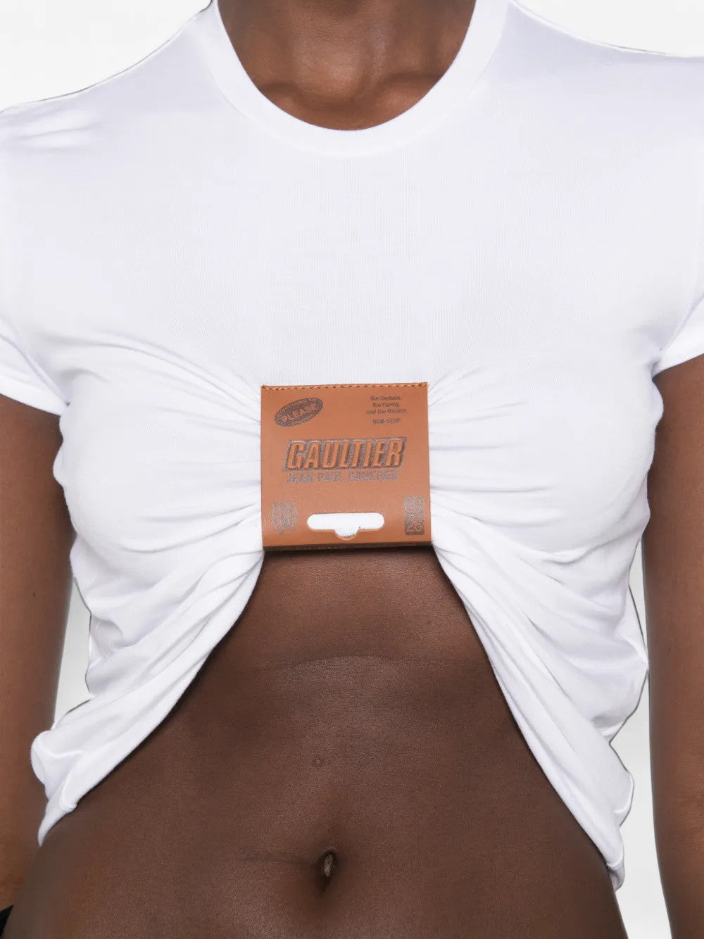 White t-shirt worn by a person, showing the t-shirt fit