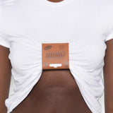 White t-shirt worn by a person, showing the t-shirt fit