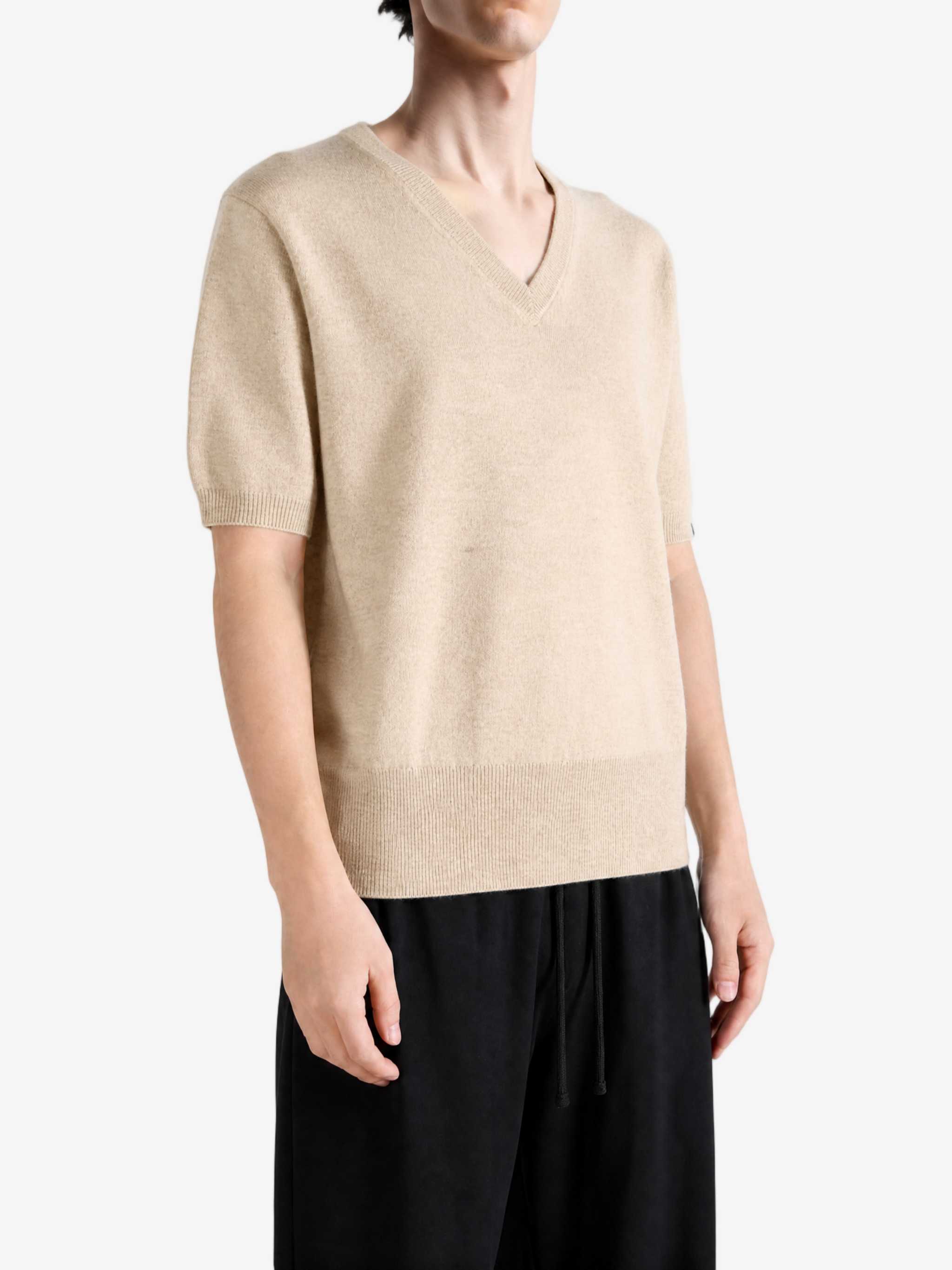 Tan hoodie worn by a person, showing the hoodie fit