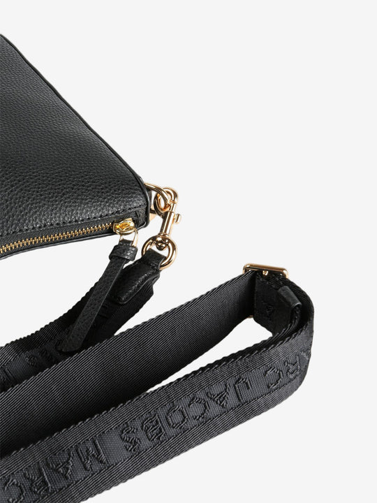 Close up of black bag, showing texture of the leather fabric
