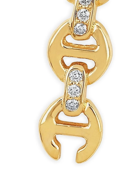 Close up of gold earring,showing texture of the 18kt yellow gold fabric