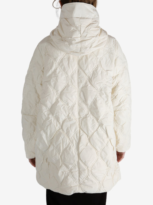 White coat worn by a person, showing the coat fit