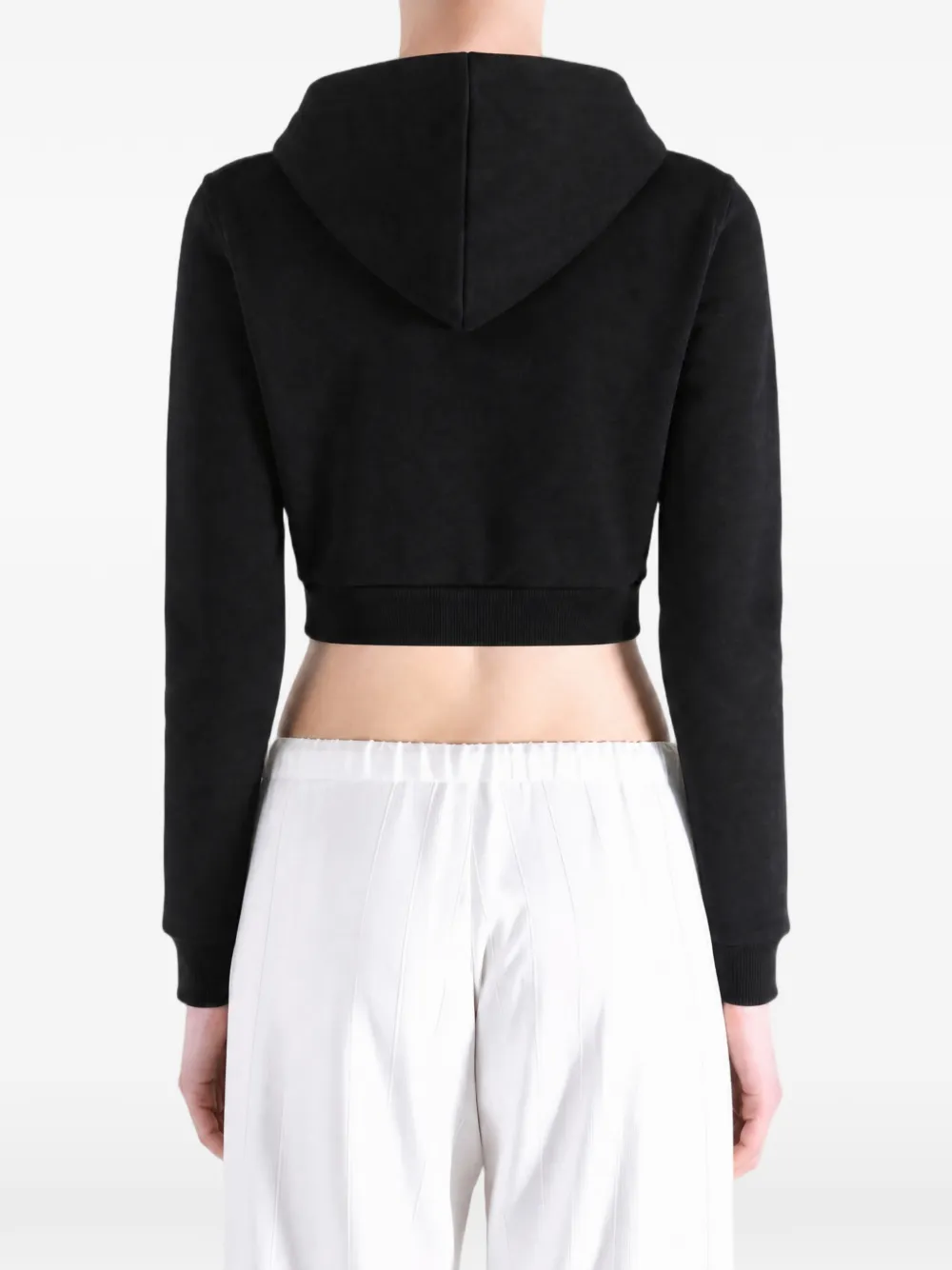 Black hoodie worn by a person, showing the hoodie's fit