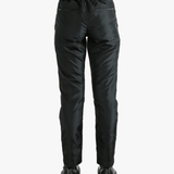 Black pants worn by a person, showing the pants' fit
