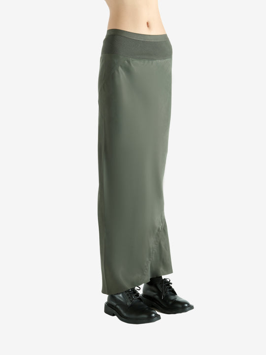 Green skirt worn by a person, showing the skirt fit
