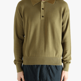 Green sweater worn by a person, showing the sweater fit