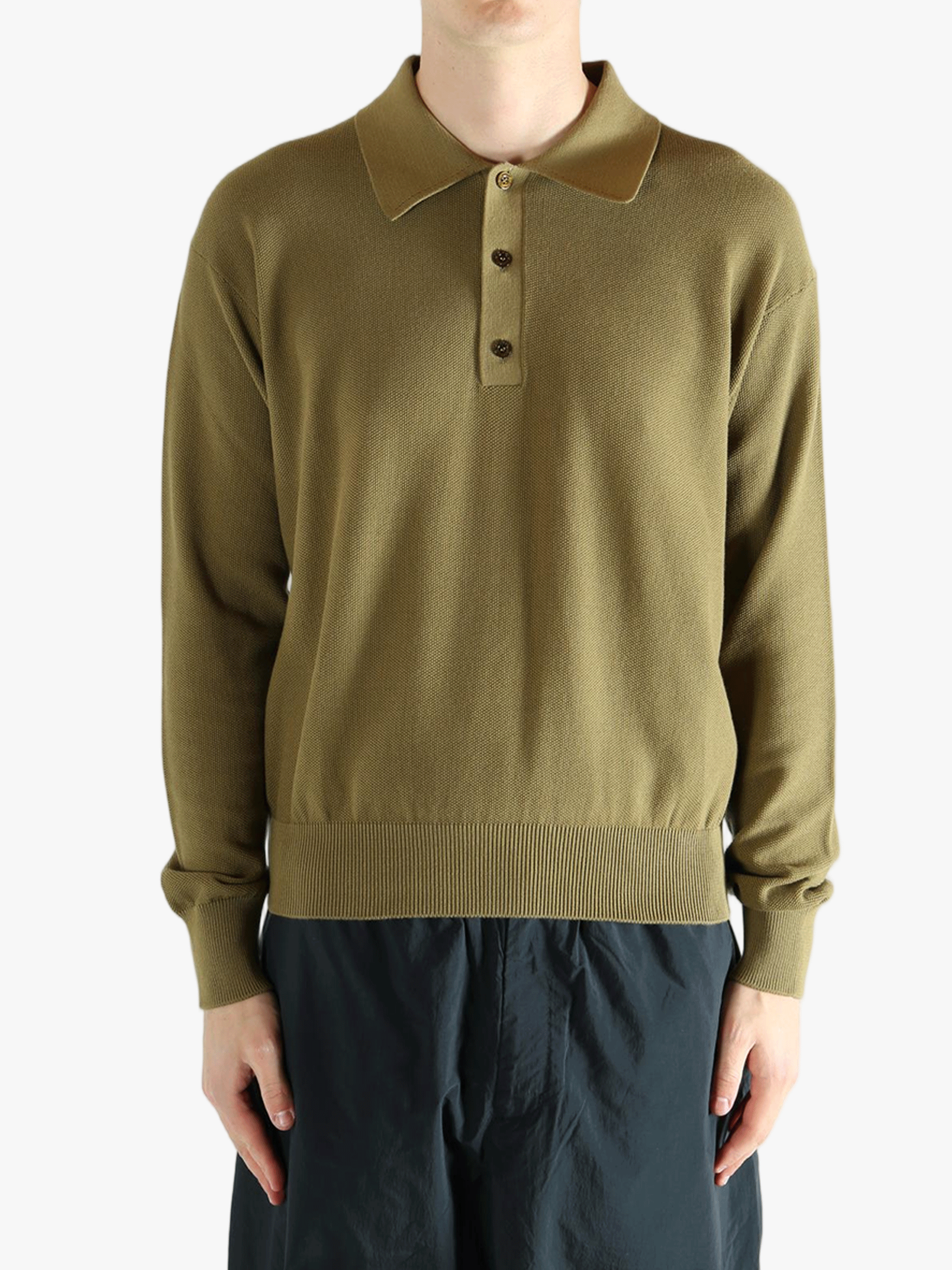 Green sweater worn by a person, showing the sweater fit