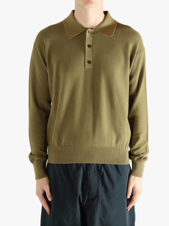 Green sweater worn by a person, showing the sweater fit