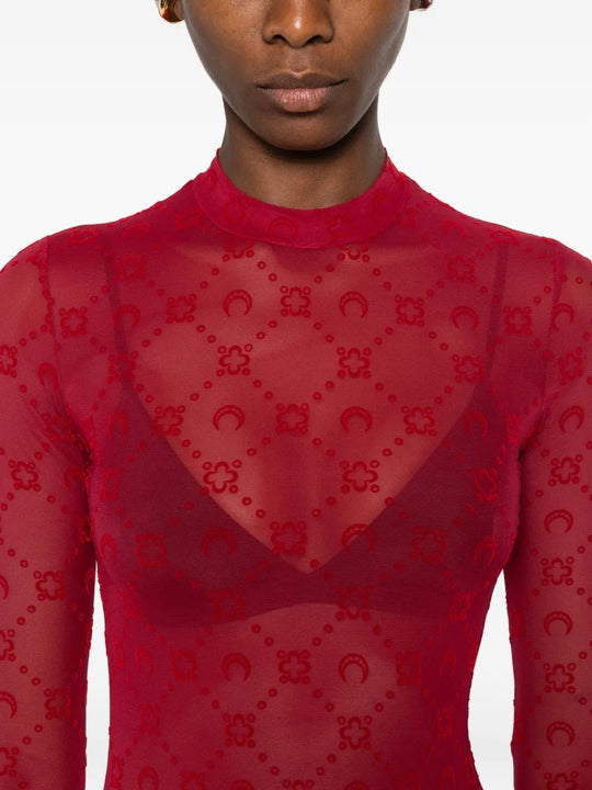 Close up of red top, showing texture of the fabirc