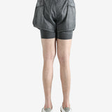 Grey shorts worn by a person, showing the shorts fit