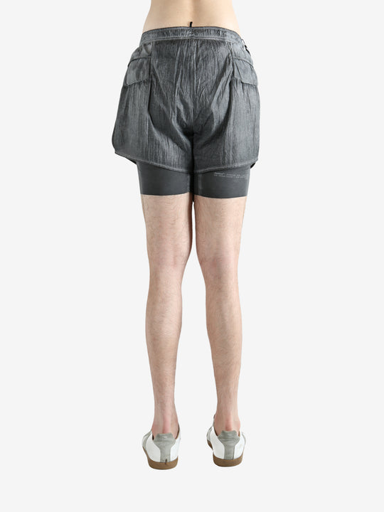 Grey shorts worn by a person, showing the shorts fit