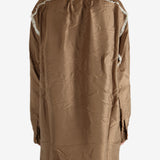 Brown shirt worn by a person, showing the shirt's fit