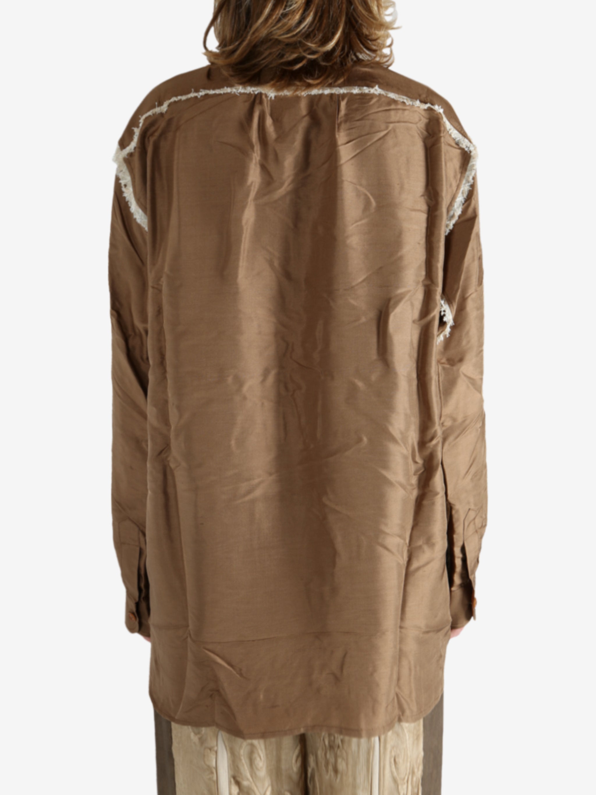 Brown shirt worn by a person, showing the shirt's fit