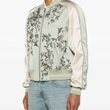 Green jackets-coat worn by a person, showing the jackets-coat's fit