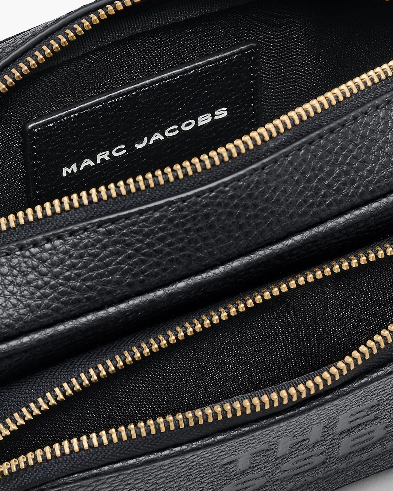 Close up of black bag, showing texture of the leather fabric