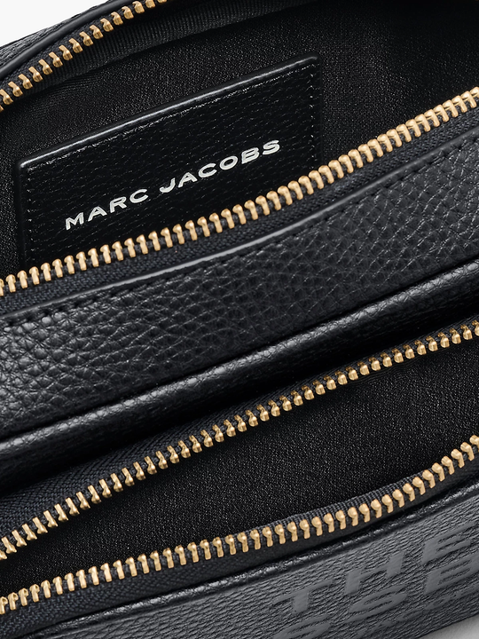 Close up of black bag, showing texture of the leather fabric