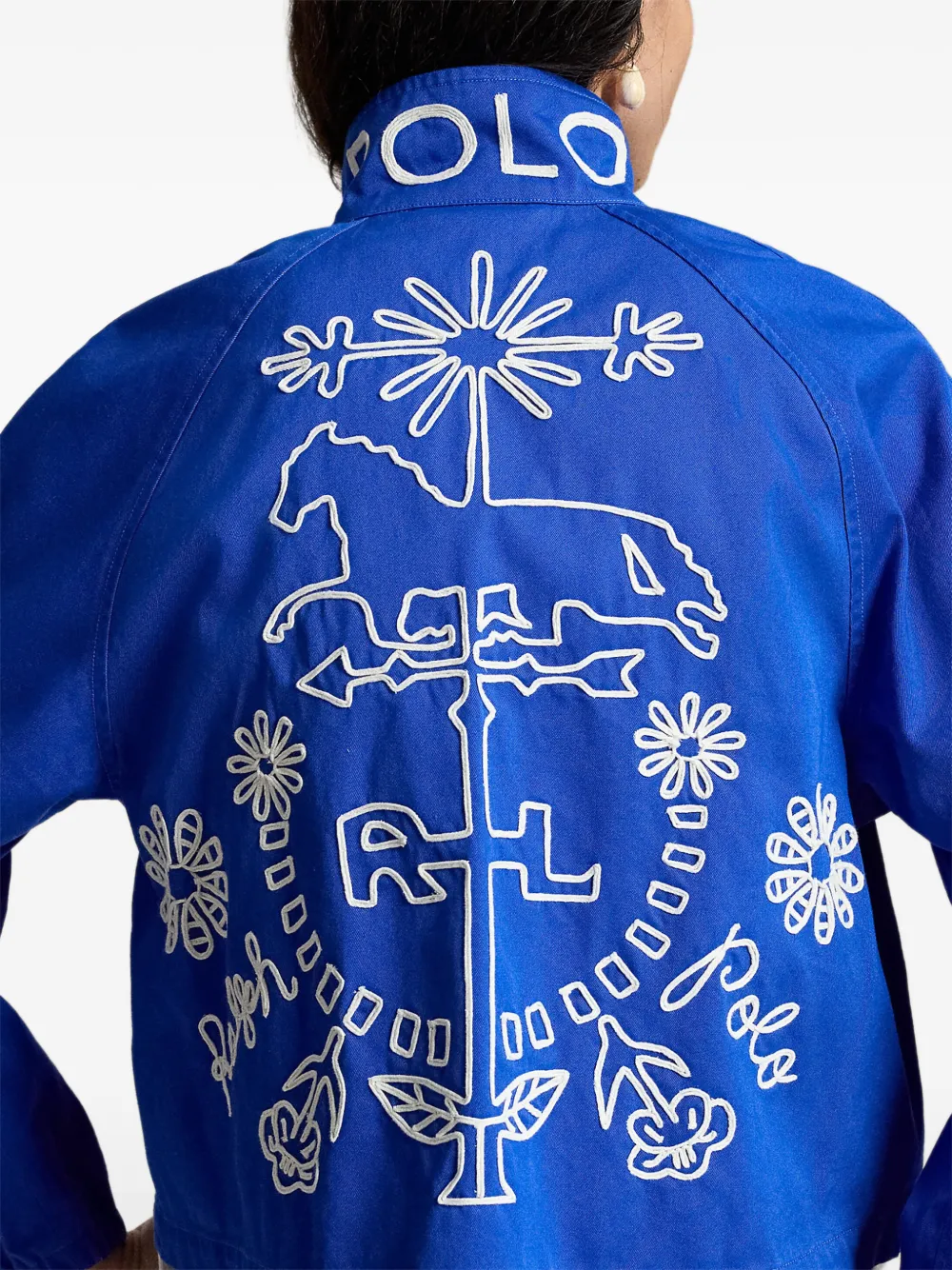 Blue jacket worn by a person, showing the jacket fit