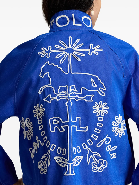 Blue jacket worn by a person, showing the jacket fit