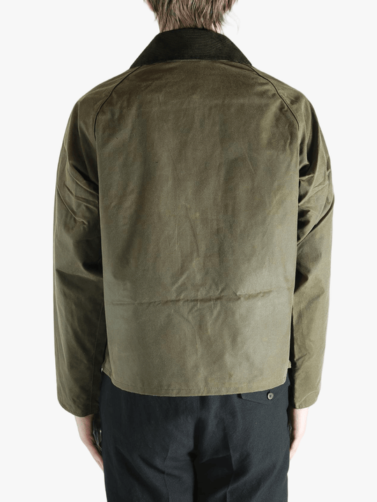 Green jacket worn by a person, showing the jacket fit