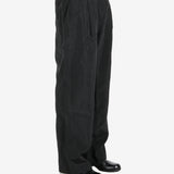 Black pant worn by a person, showing the pant’s fit