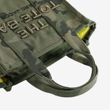 Close up of green bag, showing texture of the cotton fabric