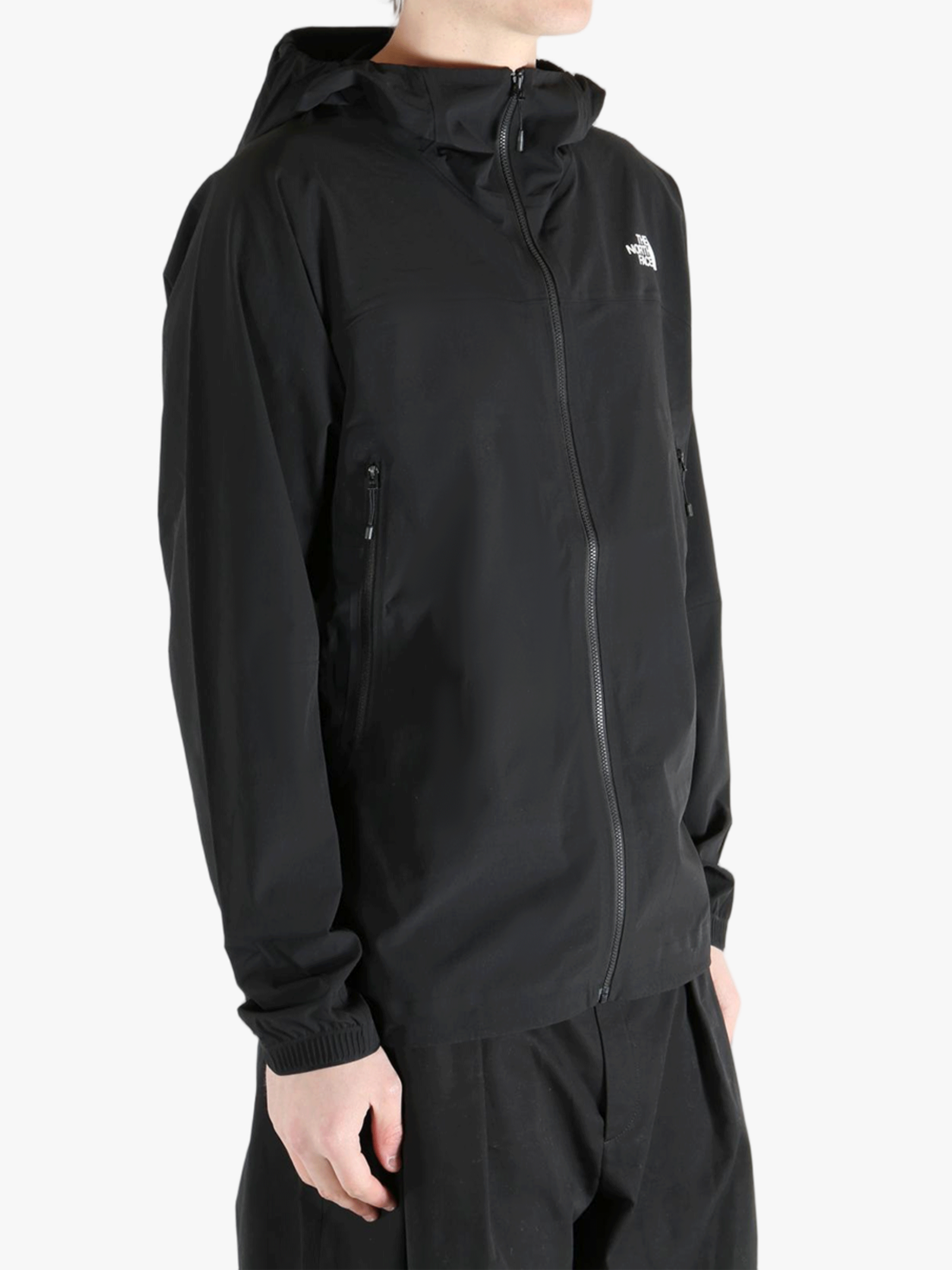 Black jacket worn by a person, showing the jacket's fit