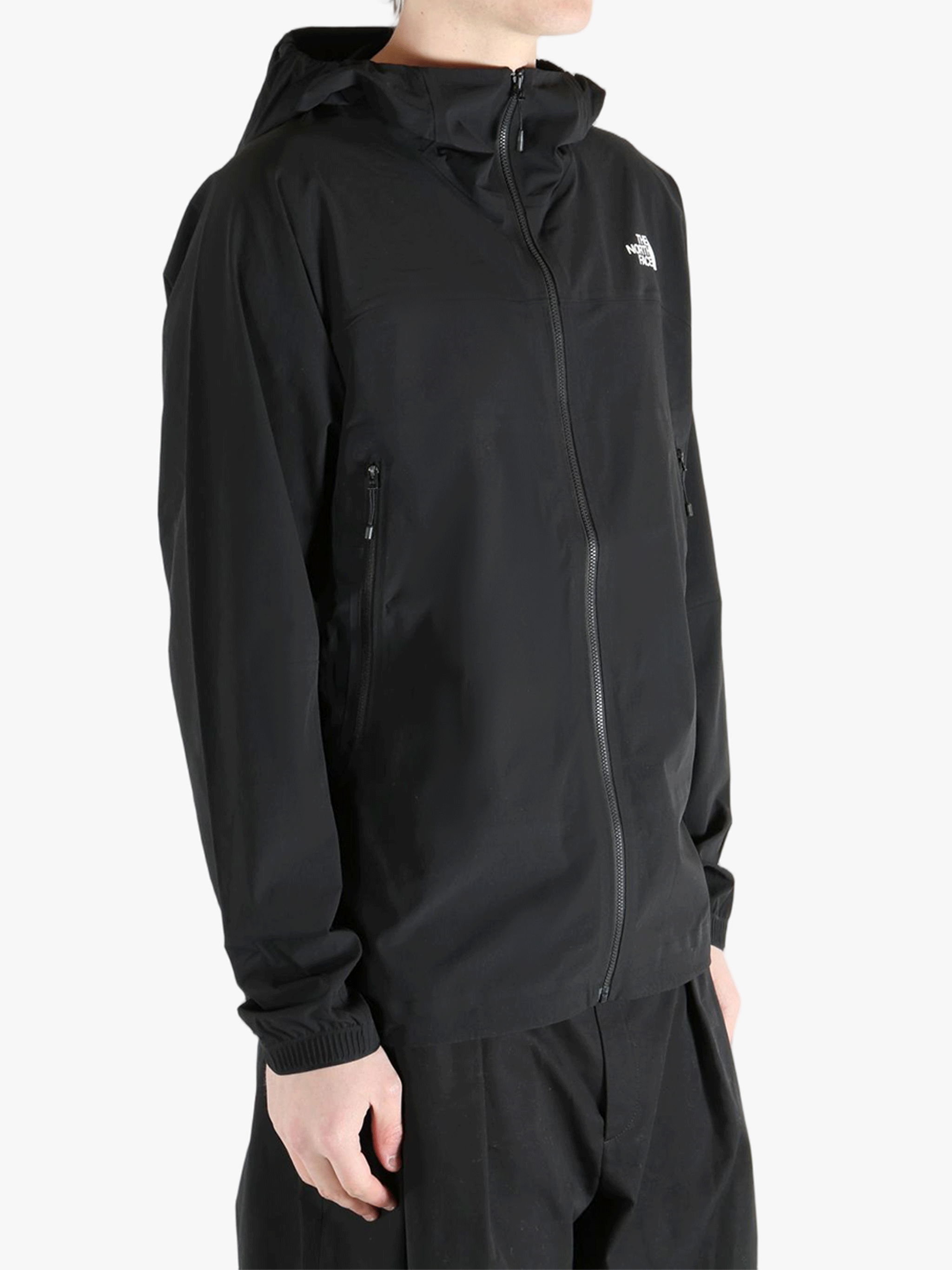 Black jacket worn by a person, showing the jacket's fit